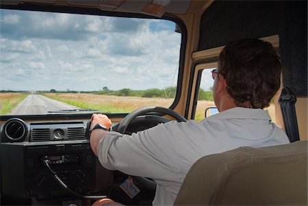 Man driving vehicle on road to Etosha, Namibia, Africa Foto de stock - Con derechos protegidos, Código: 700-07067209