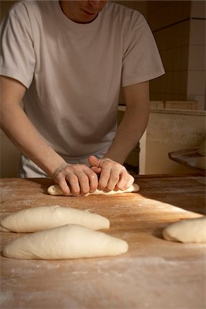 Male baker shaping bread dough by hand in bakery, Le Boulanger des Invalides, Paris, France Stockbilder - Lizenzpflichtiges, Bildnummer: 700-07156245