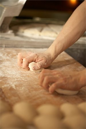 Close-up of male baker's hands kneading bread dough on floured board, Le Boulanger des Invalides, Paris, France Stock Photo - Rights-Managed, Code: 700-07156249