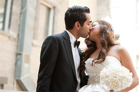 Portrait of Bride and Groom Kissing Outdoors Stock Photo - Rights-Managed, Code: 700-07199762