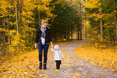 falling youth - Mother walking on Country Road with Baby Daughter in Autumn, Scanlon Creek Conservation Area, Ontario, Canada Stock Photo - Rights-Managed, Code: 700-07199782