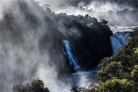 Scenic view of Iguacu Falls with streaming rays of light, Iguacu National Park, Parana, Brazil Photographie de stock - Rights-Managed, Code: 700-07204181