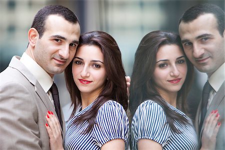 Close-up portrait of couple embracing, smiling and looking at camera, Toronto, Ontario, Canada Stock Photo - Rights-Managed, Code: 700-07203956
