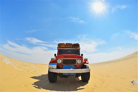 Four Wheel Drive Car in Desert with Sun, Matruh Governorate, Libyan Desert, Sahara Desert, Egypt, Africa Stock Photo - Rights-Managed, Code: 700-07279258