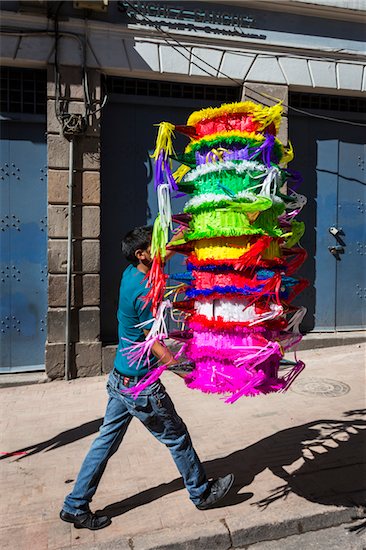 Man Carrying stack of Pinatas, Quito, Ecuador Stock Photo - Premium Rights-Managed, Artist: R. Ian Lloyd, Image code: 700-07279306