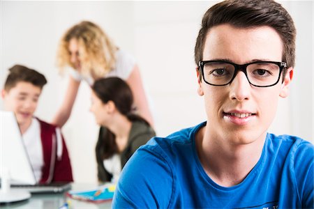 eyeglasses people smiling - Teenagers Working in Office, Mannheim, Baden-Wurttemberg, Germany Stock Photo - Rights-Managed, Code: 700-07311379