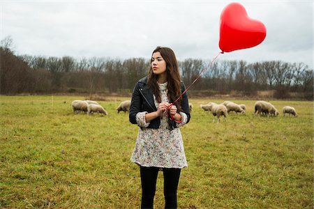 domestic animals in autumn - Young Woman with Heart-shaped Balloon by Sheep in Field, Mannheim, Baden-Wurttemberg, Germany Stock Photo - Rights-Managed, Code: 700-07355335