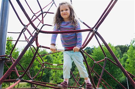 rope - Portrait of Girl Playing on Rope Jungle Gym in Playground, Italy Stock Photo - Rights-Managed, Code: 700-07363888