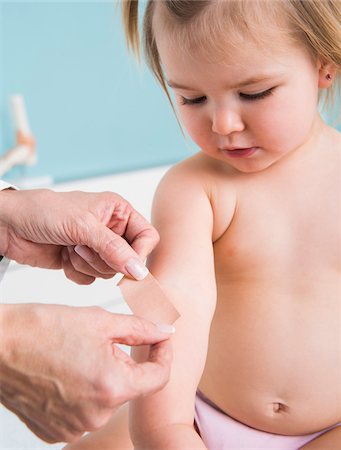 simsearch:700-07453701,k - Doctor Putting Bandage on Baby Girl's Arm in Doctor's Office Stock Photo - Rights-Managed, Code: 700-07453716