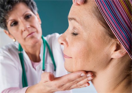 stethoscope examination - Doctor touching Woman's Face Stock Photo - Rights-Managed, Code: 700-07487566