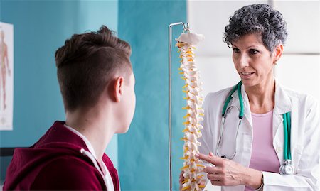 skeleton sitting down - Doctor talking with Teenage Patient in Doctor's Office Stock Photo - Rights-Managed, Code: 700-07487576