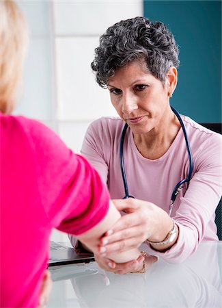 Doctor with Senior Patient in Doctor's Office Stock Photo - Rights-Managed, Code: 700-07487584