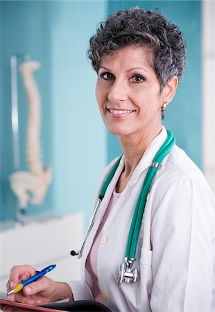 simsearch:600-03777820,k - Portrait of Doctor with Stethoscope in Doctor's Office Photographie de stock - Rights-Managed, Code: 700-07487616