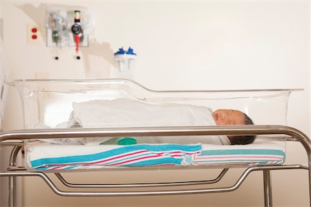 Close-up of newborn baby in hospital neonatal bassinet, Maryland, USA Stock Photo - Rights-Managed, Code: 700-07529223