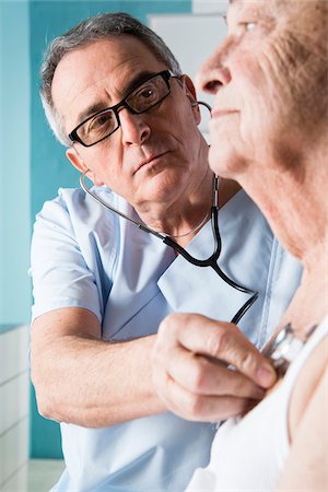 people office two people copy space - Senior, male doctor using stethoscope on senior, male patient, in office, Germany Stock Photo - Rights-Managed, Code: 700-07529244