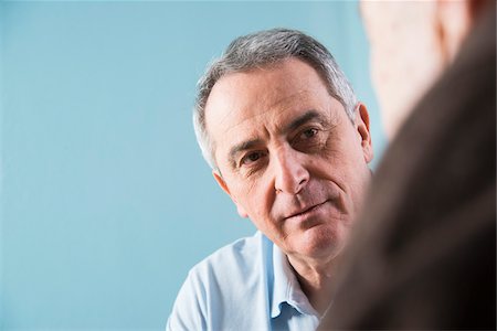 Close-up of senior, male doctor conferring with senior, male patient in office, Germany Photographie de stock - Rights-Managed, Code: 700-07529267
