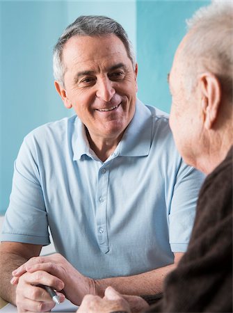 simsearch:700-07529232,k - Senior, male doctor conferring with senior, male patient in office, Germany Stock Photo - Rights-Managed, Code: 700-07529263