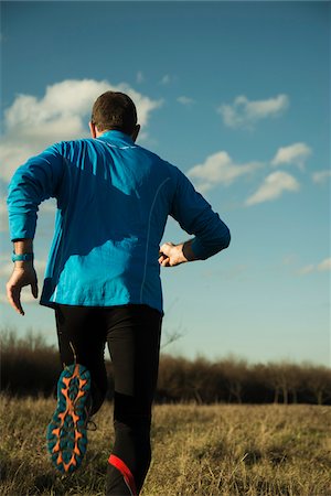 semelle (soulier) - Back View of Mature Man Running Outdoors, Mannheim, Baden-Wurttemberg, Germany Photographie de stock - Rights-Managed, Code: 700-07562396