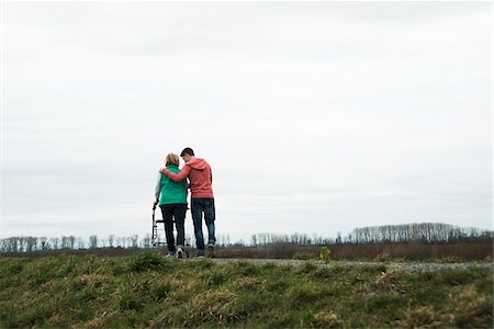 Backview of teenage grandson with grandmother using walker on pathway in park, walking in nature, Germany Stock Photo - Rights-Managed, Code: 700-07584823