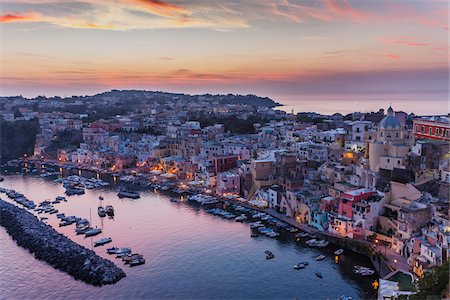 Dusk view of marina and harbour, Corricella, Procida, Gulf of Naples, Campania, Italy. Photographie de stock - Rights-Managed, Code: 700-07608363