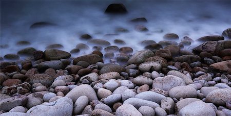 Close-up of shoreline with boulders and incoming tide, long exposure, Scotland. Stock Photo - Rights-Managed, Code: 700-07672290