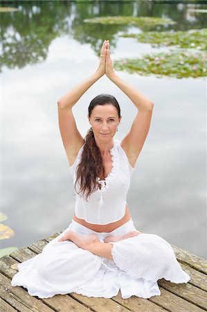 Mature Woman doing Yoga in Park in Summer, Bavaria, Germany Stock Photo - Rights-Managed, Code: 700-07707644