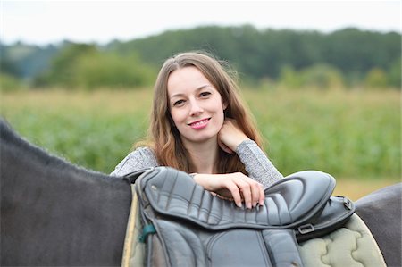 Close-up portrait of a young woman with an Arab-Haflinger horse on a field in summer, Upper Palatinate, Bavaria, Germany Stock Photo - Rights-Managed, Code: 700-07734356