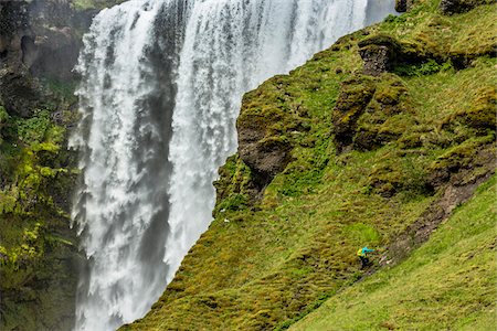 Person Climbing Slope by Skogafoss, Iceland Foto de stock - Con derechos protegidos, Código: 700-07745169