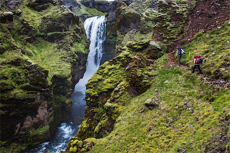 Hikers on Fimmvorduhals Hiking Trail along River above Skogafoss Falls, South Iceland, Iceland Stock Photo - Rights-Managed, Code: 700-07745197