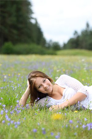 simsearch:700-08080567,k - Close-up of a young woman in a flower meadow in summer, Upper Palatinate, Bavaria, Germany Stockbilder - Lizenzpflichtiges, Bildnummer: 700-07760184