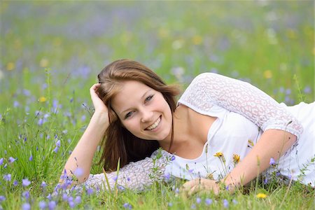 Close-up of a young woman in a flower meadow in summer, Upper Palatinate, Bavaria, Germany Stock Photo - Rights-Managed, Code: 700-07760185