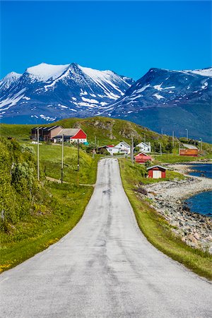 snowcapped mountains with a road - Bakkejord, Kvaloya Island, Tromso, Norway Stock Photo - Rights-Managed, Code: 700-07784081