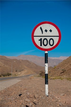 Speed Limit Road Sign with Arabic Writing against Blue Sky, Oman Photographie de stock - Rights-Managed, Code: 700-07784136