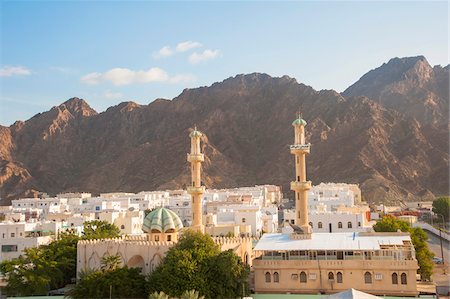 Cityscape with Two Towers of Mosque with Mountains in the background, Muscat, Oman Stock Photo - Rights-Managed, Code: 700-07784132