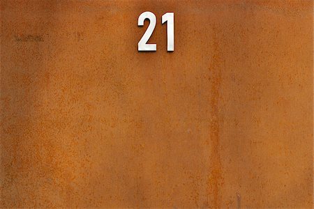 Close-up of rusty door with number twenty-one, Germany Stock Photo - Rights-Managed, Code: 700-07784548