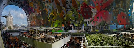 Interior of new Markthal Rotterdam with restaurants, food stalls and modern artwork on ceiling. The center of the market space is covered with a structure of residential apartments, Rotterdam, Netherlands Stock Photo - Rights-Managed, Code: 700-07783661