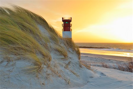 Beach with Lighthouse at Sunrise, Helgoland, North Sea, Schleswig-Holstein, Germany Foto de stock - Con derechos protegidos, Código: 700-07844612