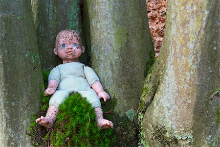 Dirty Doll between Trees, Hesse, Germany Stock Photo - Rights-Managed, Code: 700-07848076