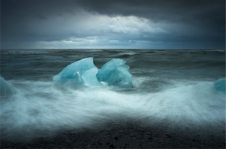 Icebergs Stranded on Stormy Beach in Winter, Iceland Stock Photo - Rights-Managed, Code: 700-07840744