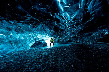 Interior of Ice Cave with Mountain Guide, Iceland Foto de stock - Direito Controlado, Número: 700-07840748