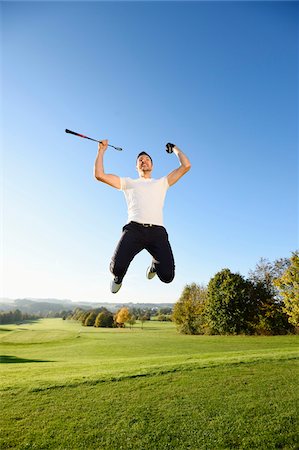 Golfer Jumping in the Air on Golf Course in Autumn, Bavaria, Germany Photographie de stock - Rights-Managed, Code: 700-07944980