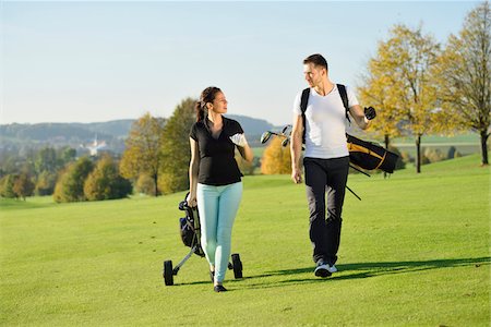 ethnic golf - Couple Playing Golf on Golf Course in Autumn, Bavaria, Germany Stock Photo - Rights-Managed, Code: 700-07942522