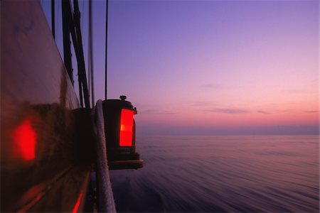 Detail of Port Navigation Running Light at Dawn aboard Schooner, Treee of Life Stockbilder - Lizenzpflichtiges, Bildnummer: 700-07965867