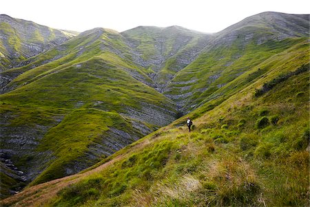 Woman on a hike with the Apennine Mountains, Monti della Laga, viewed from Campotosto in summer, Gran Sasso and Monti della Laga National Park, Abruzzo, Italy Photographie de stock - Rights-Managed, Code: 700-08102722