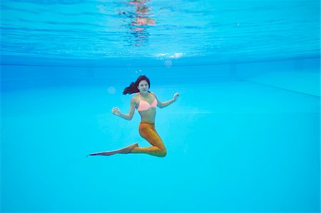 swimming girls in water - Portrait of Teenage Girl with Mermaid Tail Underwater Stock Photo - Rights-Managed, Code: 700-08122207