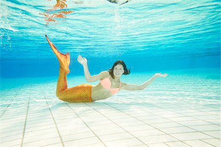 Portrait of Teenage Girl with Mermaid Tail Underwater Stock Photo - Rights-Managed, Code: 700-08122203