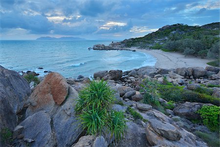 rocky coast and boulder coast - Sandy beach with Granite Stones, Horseshoe Bay, Bowen, Queensland, Australia Stock Photo - Rights-Managed, Code: 700-08146487