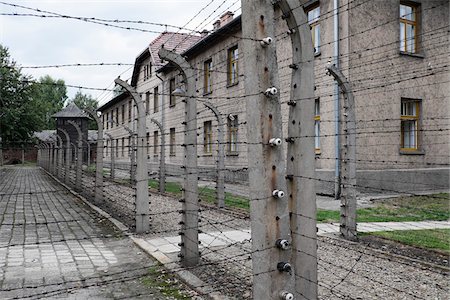 Barbed wire fences and buildngs, Auschwitz, Poland Stock Photo - Rights-Managed, Code: 700-08232193