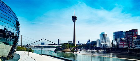 panoramic cityscapes - View of the Rheinturm Dusseldorf (TV Tower) in Media Harbour with Neuer Zollhof  on the right, Dusseldorf, Germany Stock Photo - Rights-Managed, Code: 700-08353442