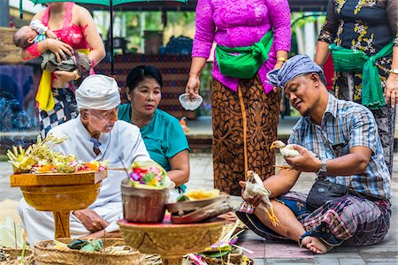 Hindu priest with family at a Bulan Pitung Dina (One Month and One Week) purification ceremony for baby and parents, Ubud, Bali, Indonesia Photographie de stock - Rights-Managed, Code: 700-08385868